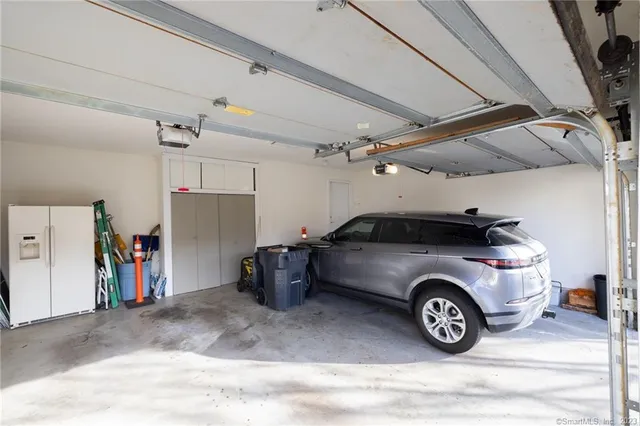a view of a garage and car parked