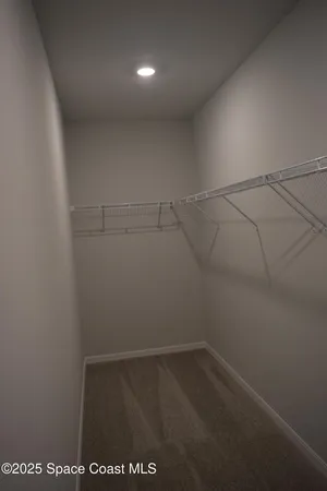 a view of a room with racks on the wall