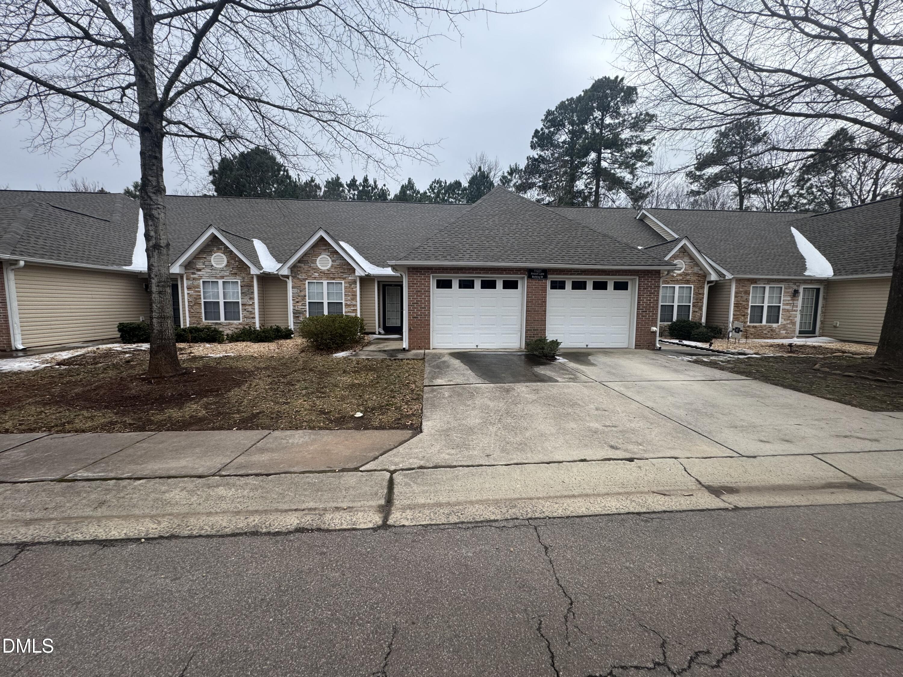 front view of a house with a bench