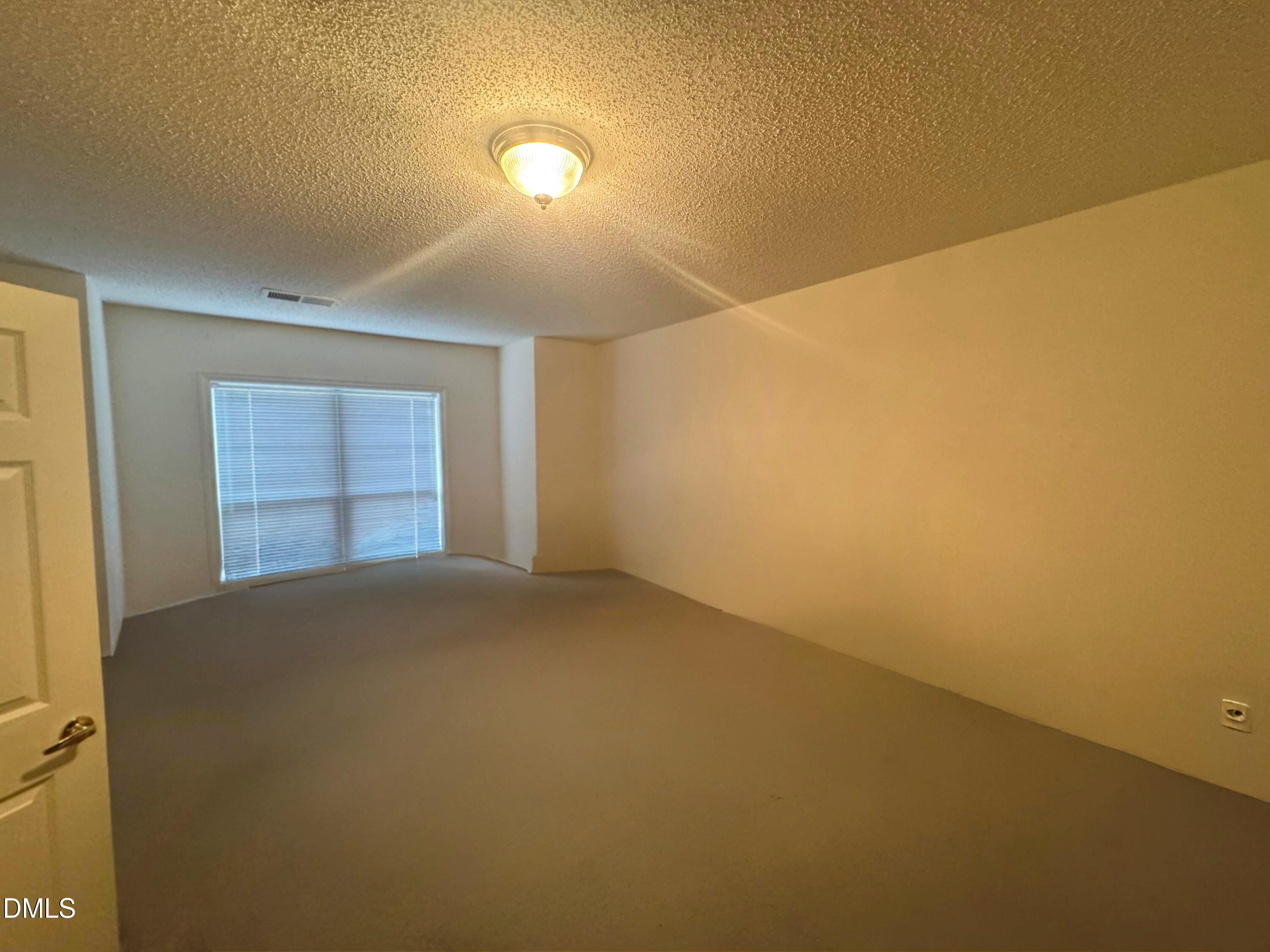 11221 Avocet Lane, Unit 102 Raleigh, NC 27617 - Photo 11 of 14 a view of empty room