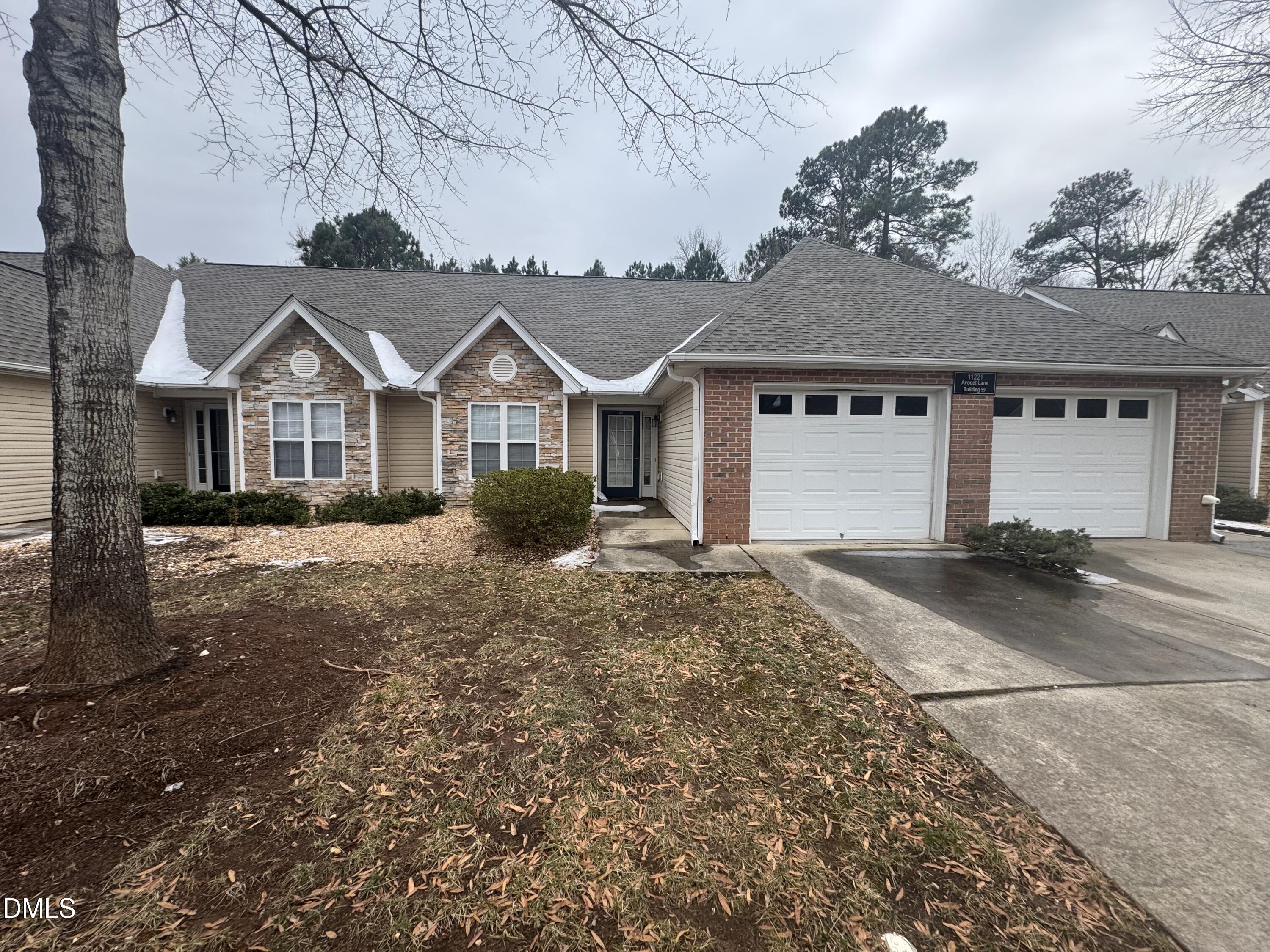 11221 Avocet Lane, Unit 102 Raleigh, NC 27617 - Photo 2 of 14 front view of a house with a yard