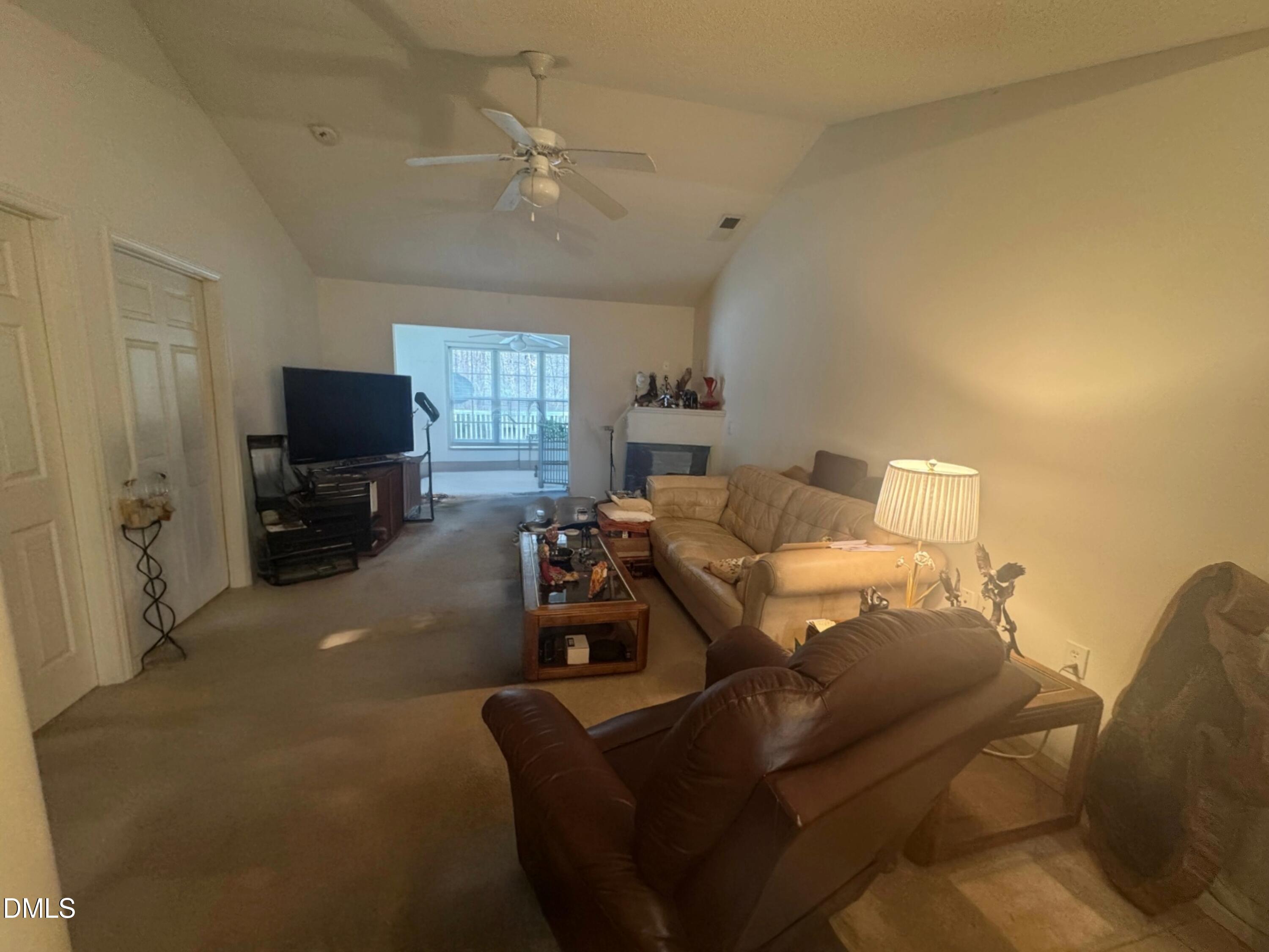 11221 Avocet Lane, Unit 102 Raleigh, NC 27617 - Photo 6 of 14 a living room with furniture and a flat screen tv
