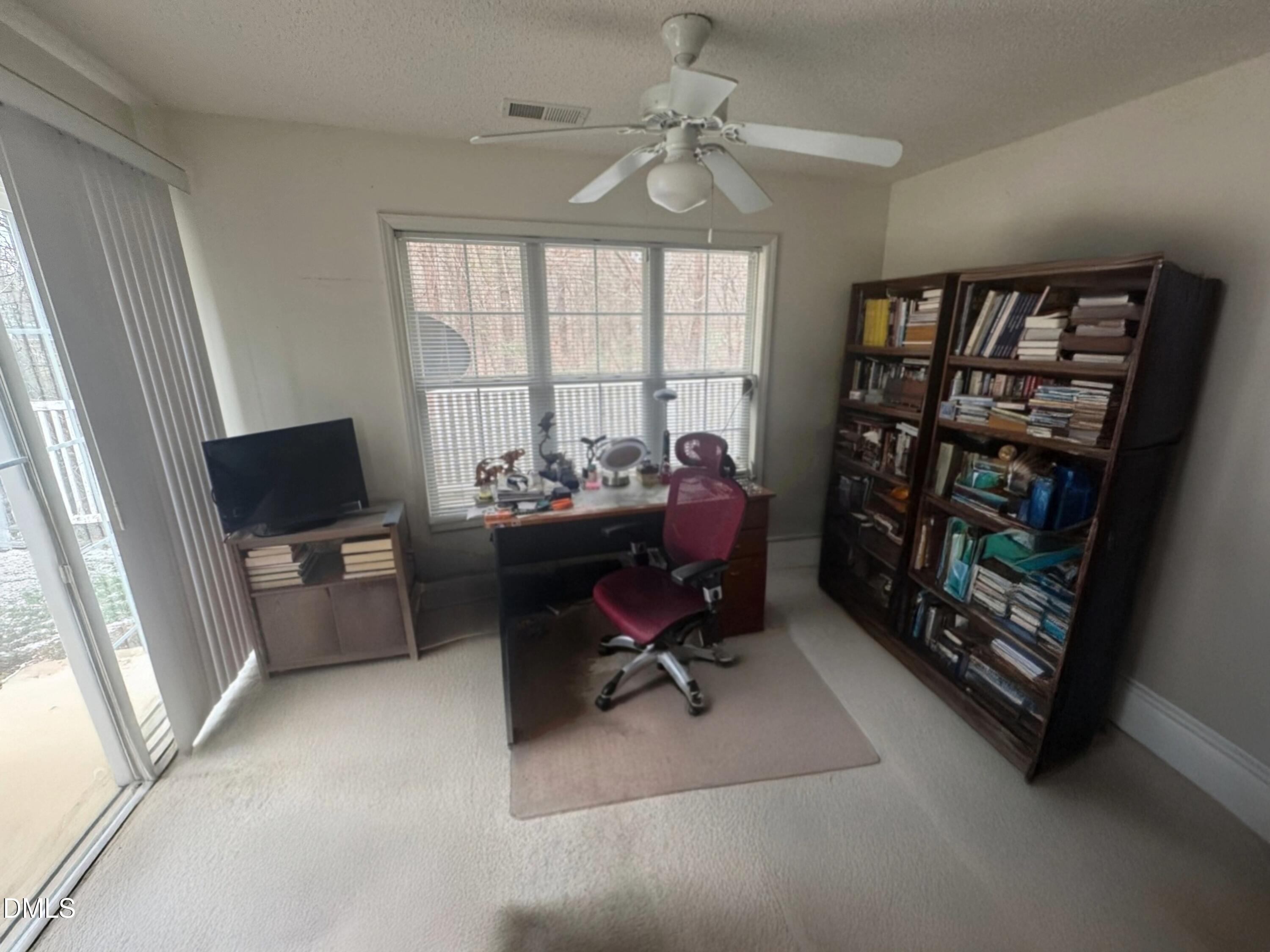 11221 Avocet Lane, Unit 102 Raleigh, NC 27617 - Photo 7 of 14 a view of a livingroom with workspace and a window