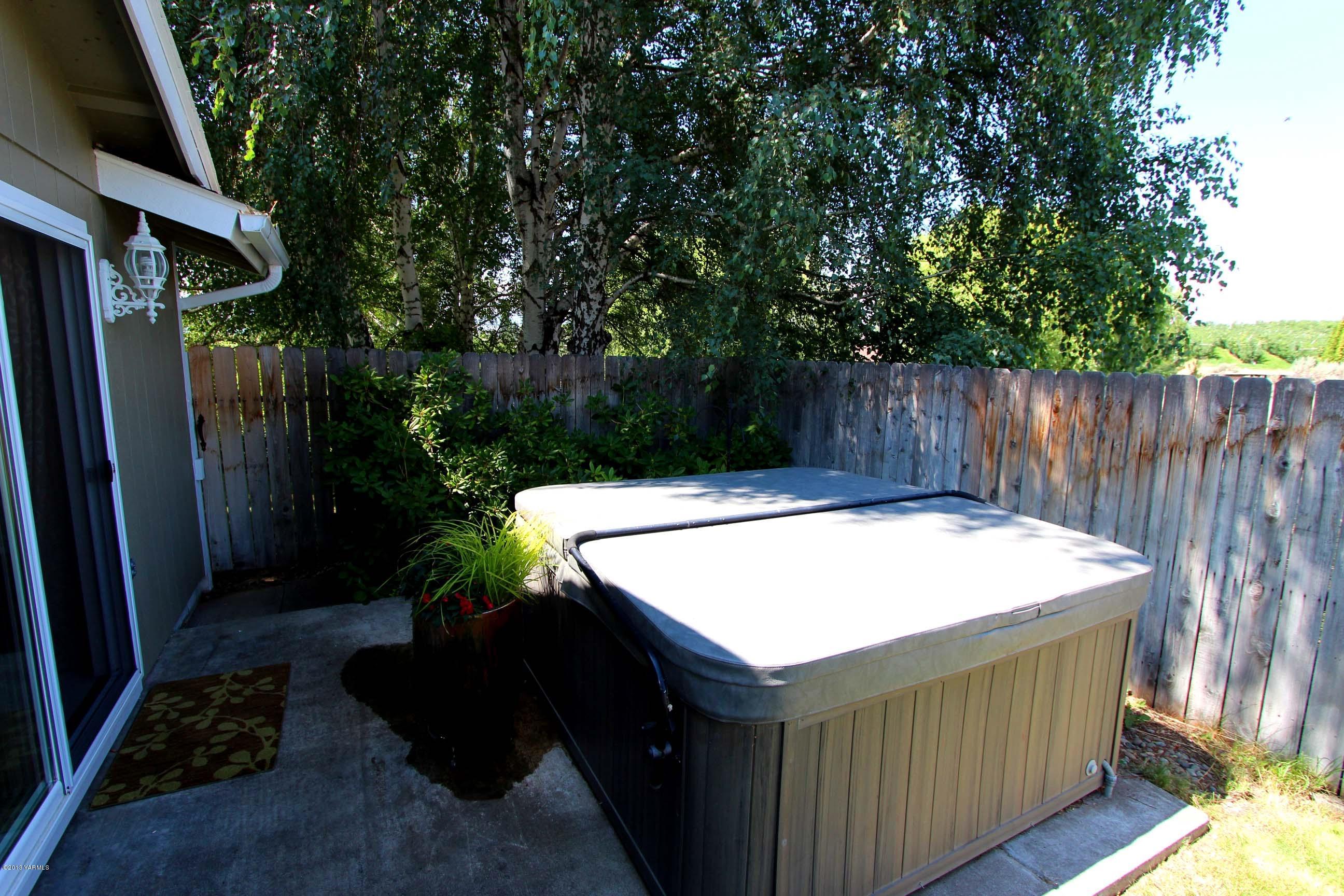 170 Wilcox Road Cowiche, WA 98923 - Photo 32 of 39 a view of a backyard with a small cabin and a chair