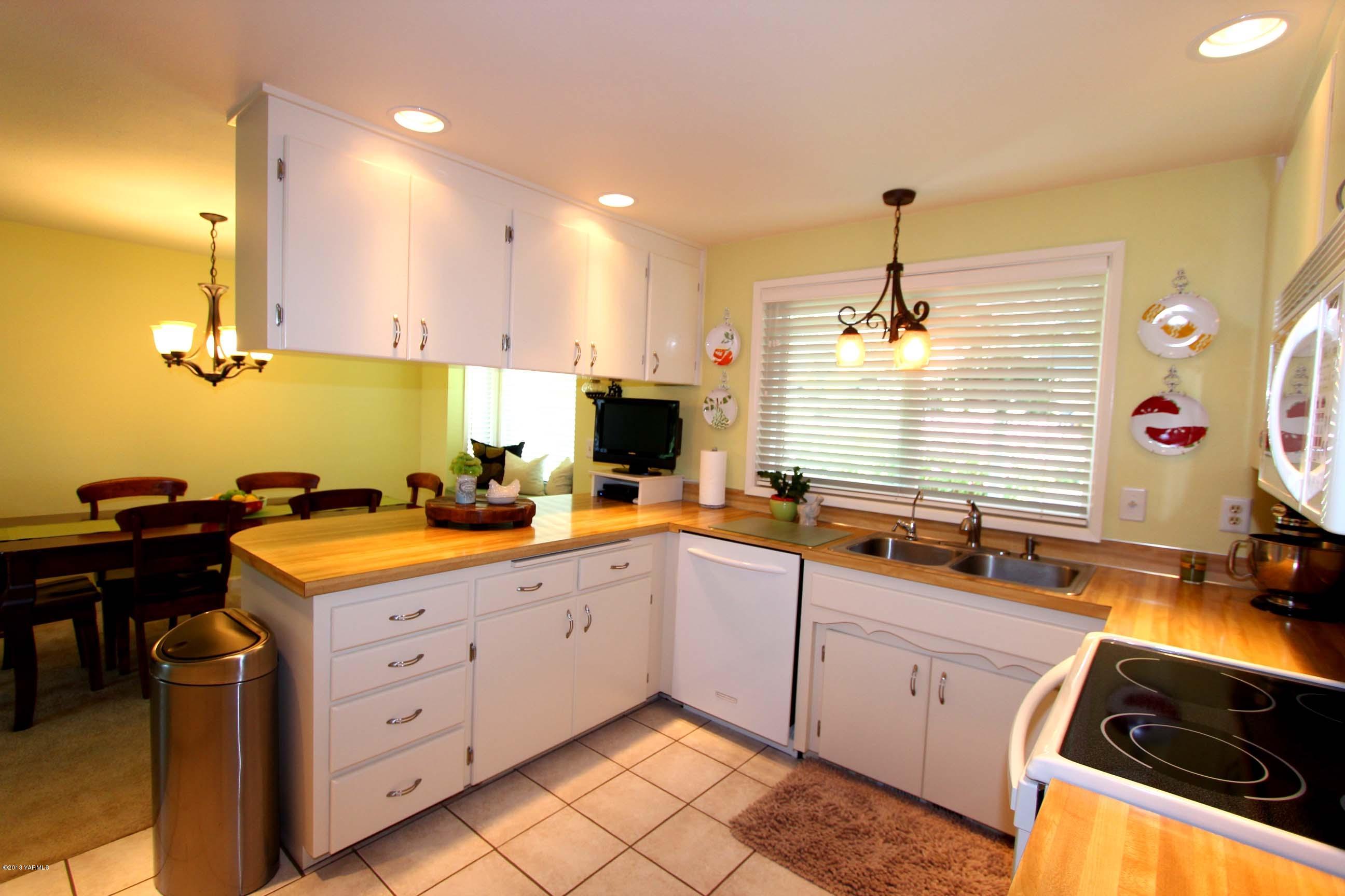 170 Wilcox Road Cowiche, WA 98923 - Photo 8 of 39 a kitchen with a sink stove and cabinets