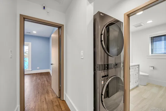 a view of a hallway with washer and dryer