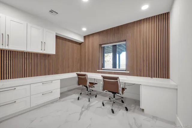 a work room with furniture and windows