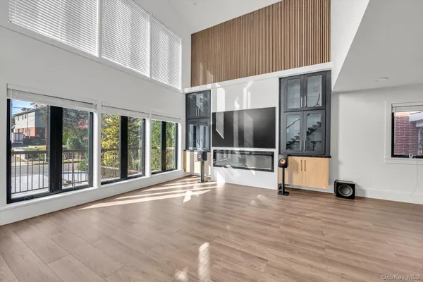 a view of an entryway with wooden floor