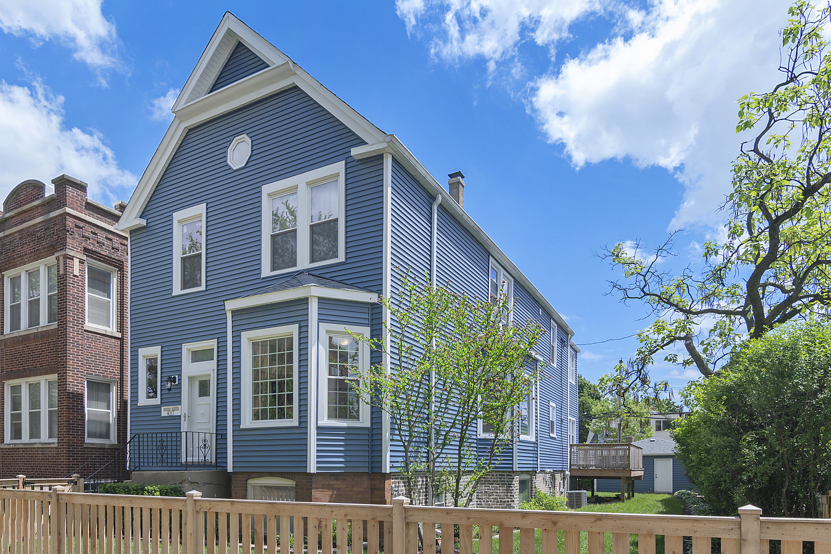4017 North Spaulding Avenue Chicago, IL 60618 - Photo 1 of 30 a front view of a house with a garden