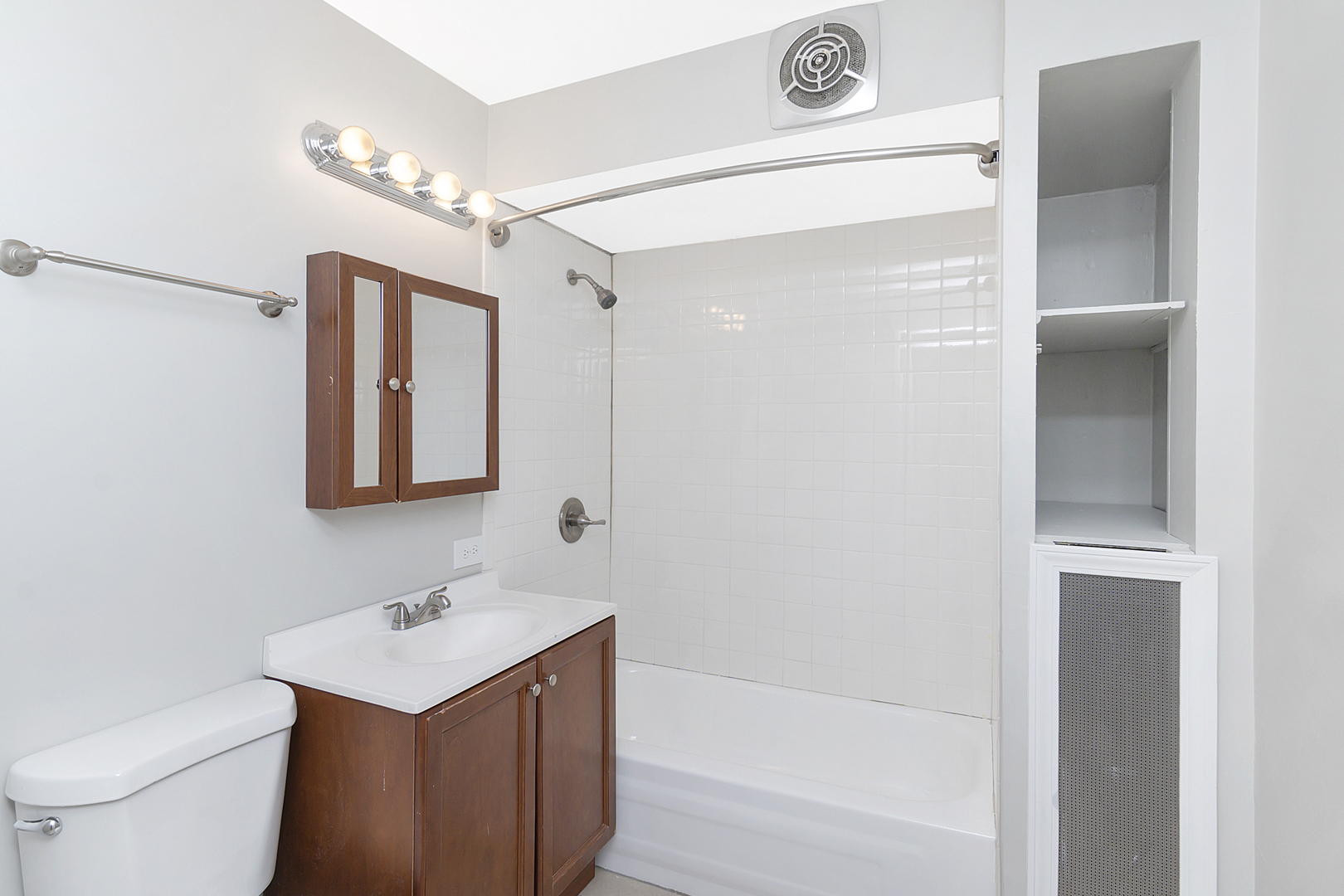 4017 North Spaulding Avenue Chicago, IL 60618 - Photo 11 of 30 a bathroom with a sink a toilet a mirror and shower