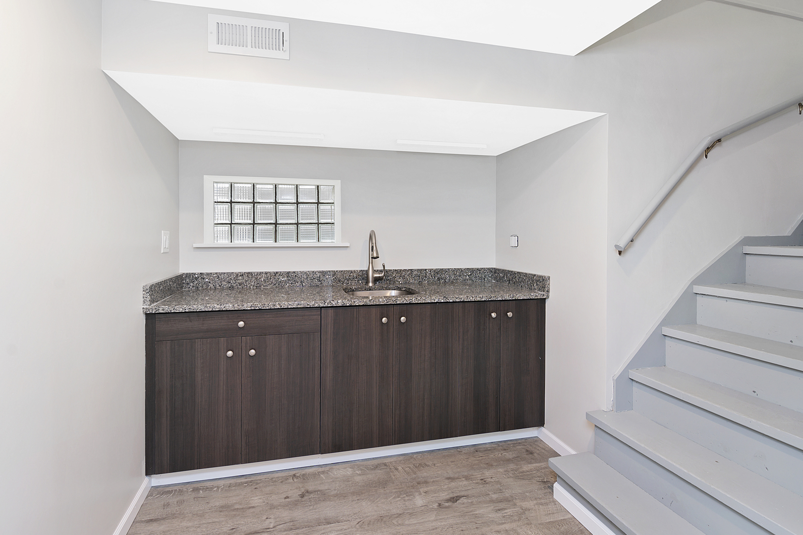 4017 North Spaulding Avenue Chicago, IL 60618 - Photo 14 of 30 a bathroom with a granite countertop sink and mirror