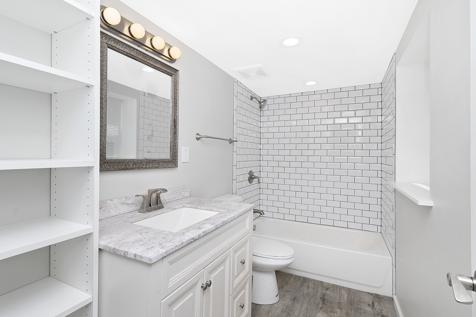 4017 North Spaulding Avenue Chicago, IL 60618 - Photo 16 of 30 a bathroom with a granite countertop sink toilet and shower