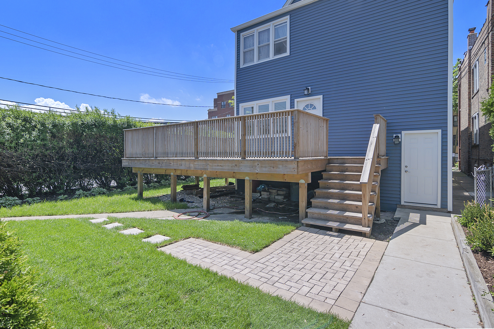 4017 North Spaulding Avenue Chicago, IL 60618 - Photo 18 of 30 a view of a house with a yard and plants