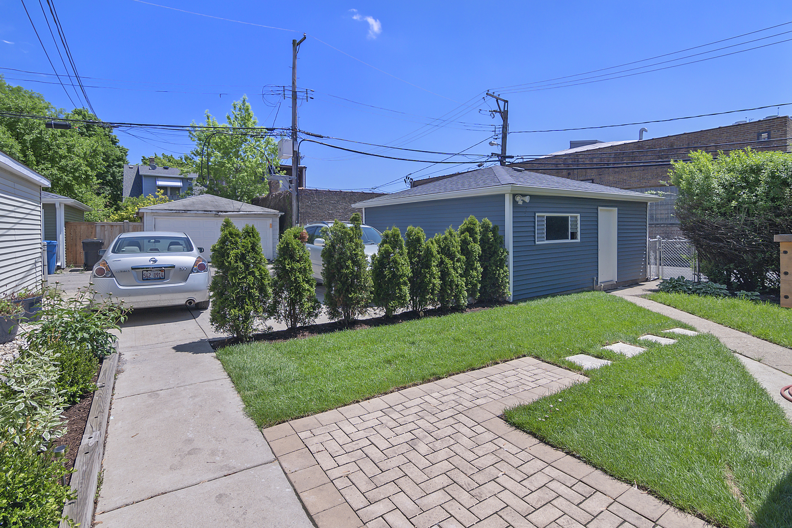 4017 North Spaulding Avenue Chicago, IL 60618 - Photo 20 of 30 a front view of a house with a yard