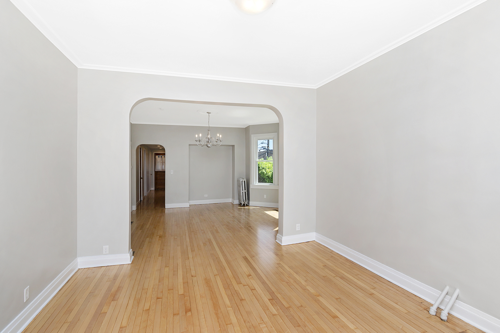 4017 North Spaulding Avenue Chicago, IL 60618 - Photo 3 of 30 a view of a room with wooden floor and a window