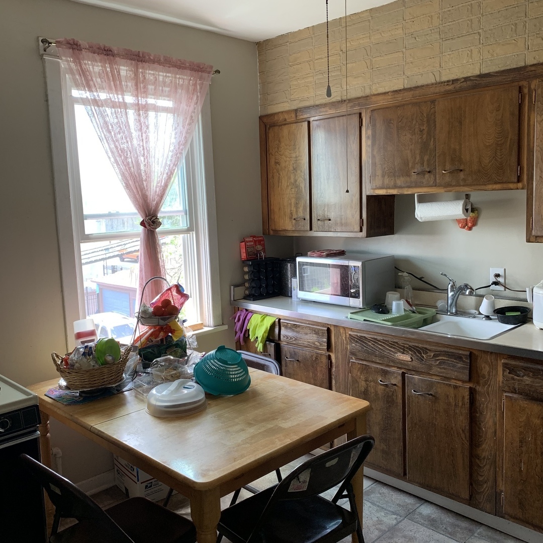 4017 North Spaulding Avenue Chicago, IL 60618 - Photo 27 of 30 a kitchen with a table and chairs in it
