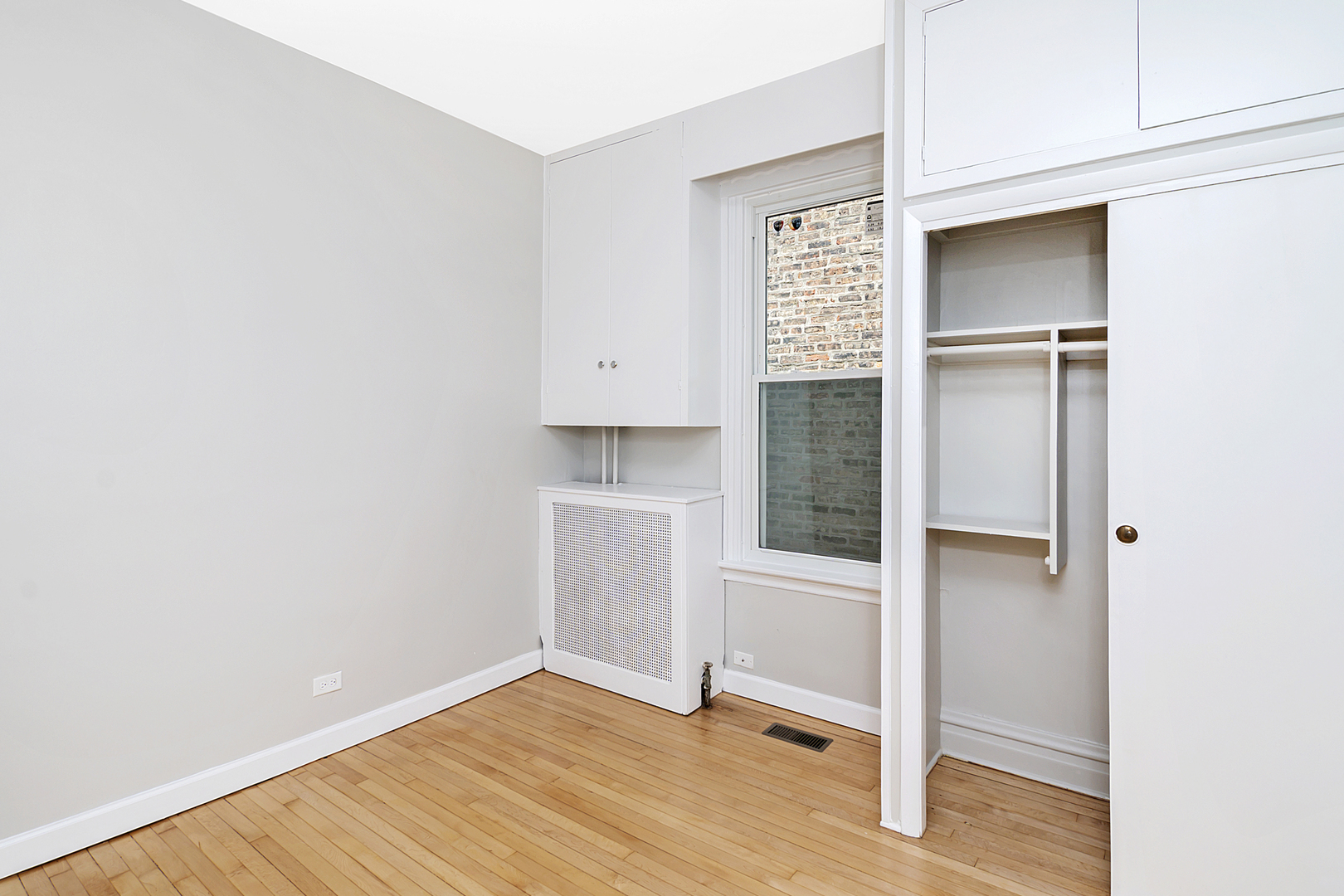 4017 North Spaulding Avenue Chicago, IL 60618 - Photo 8 of 30 a view of an empty room with wooden floor and closet