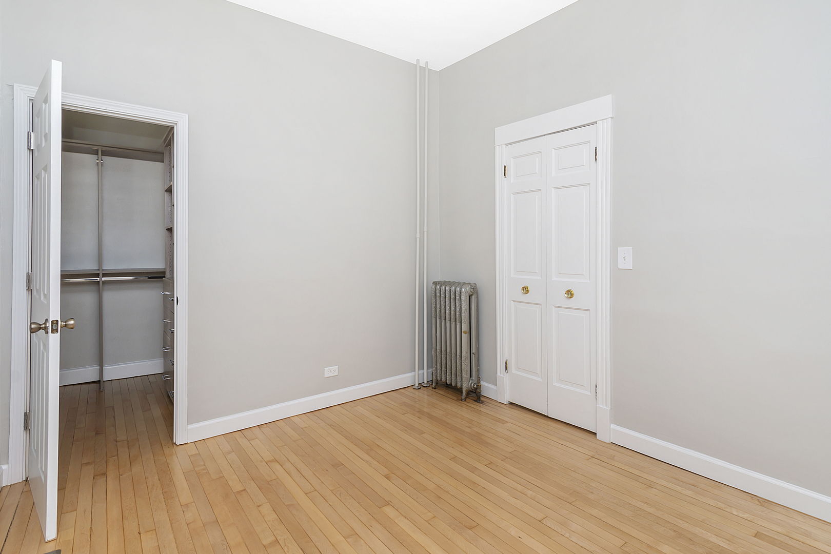 4017 North Spaulding Avenue Chicago, IL 60618 - Photo 9 of 30 an empty room with wooden floor and closet