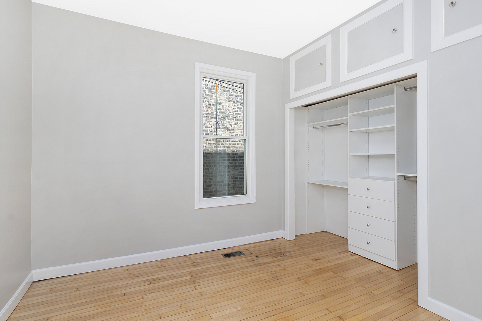 4017 North Spaulding Avenue Chicago, IL 60618 - Photo 10 of 30 a view of an empty room with a window and closet area