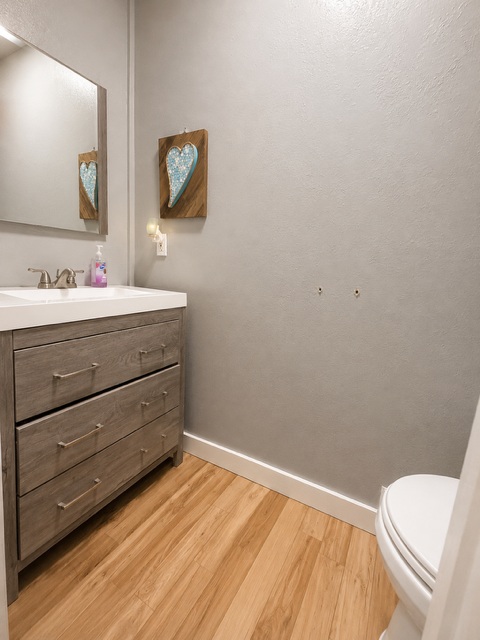 221 Winding Way Road Marble Falls, TX 78654 - Photo 12 of 19 A well-appointed bathroom features a light-toned vanity and coordinated flooring.