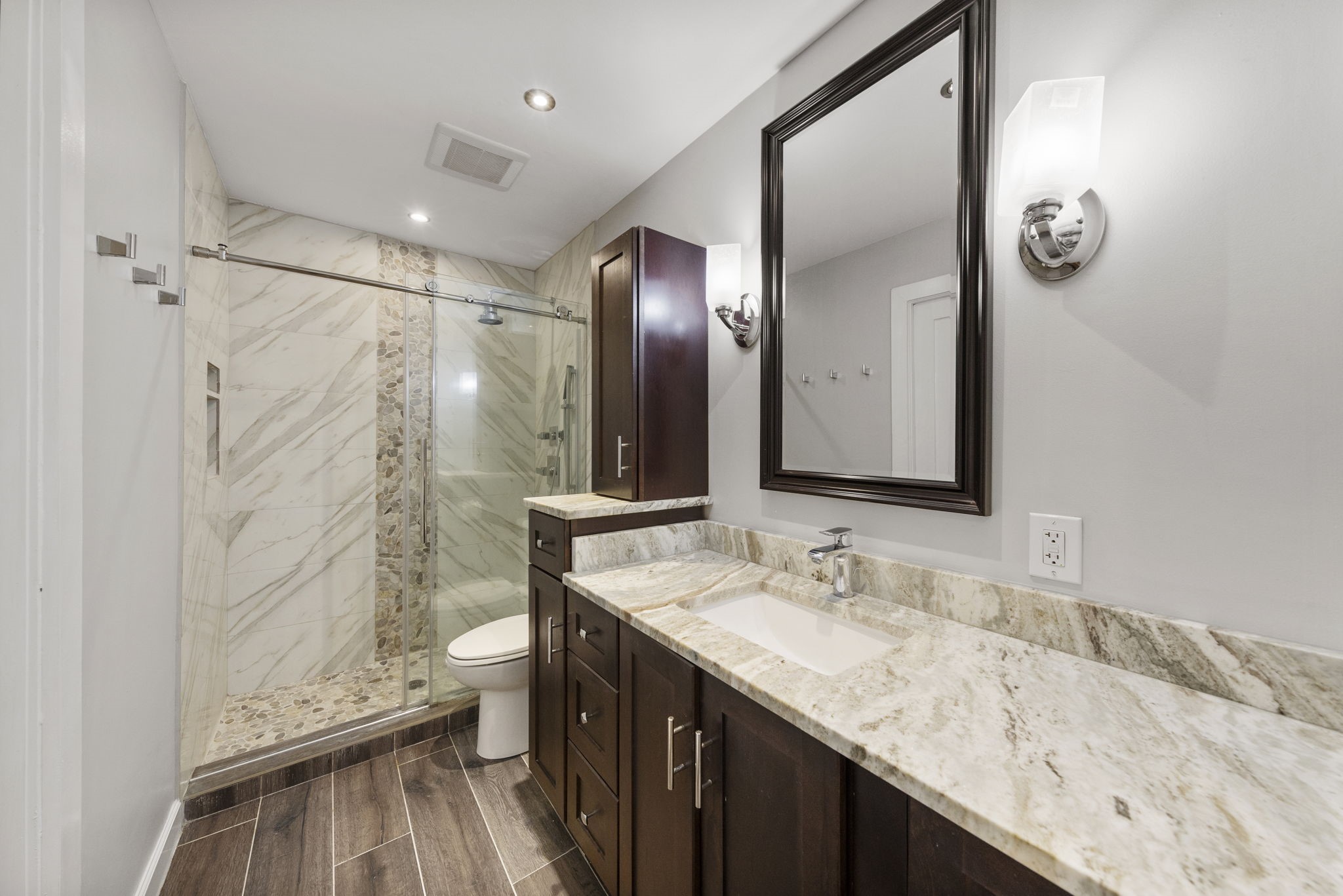 801 River Road, Unit 105C Montgomery, TX 77356 - Photo 21 of 30 Elegant rich cabinetry and built-in linen storage provide the perfect combination of beauty and organization.