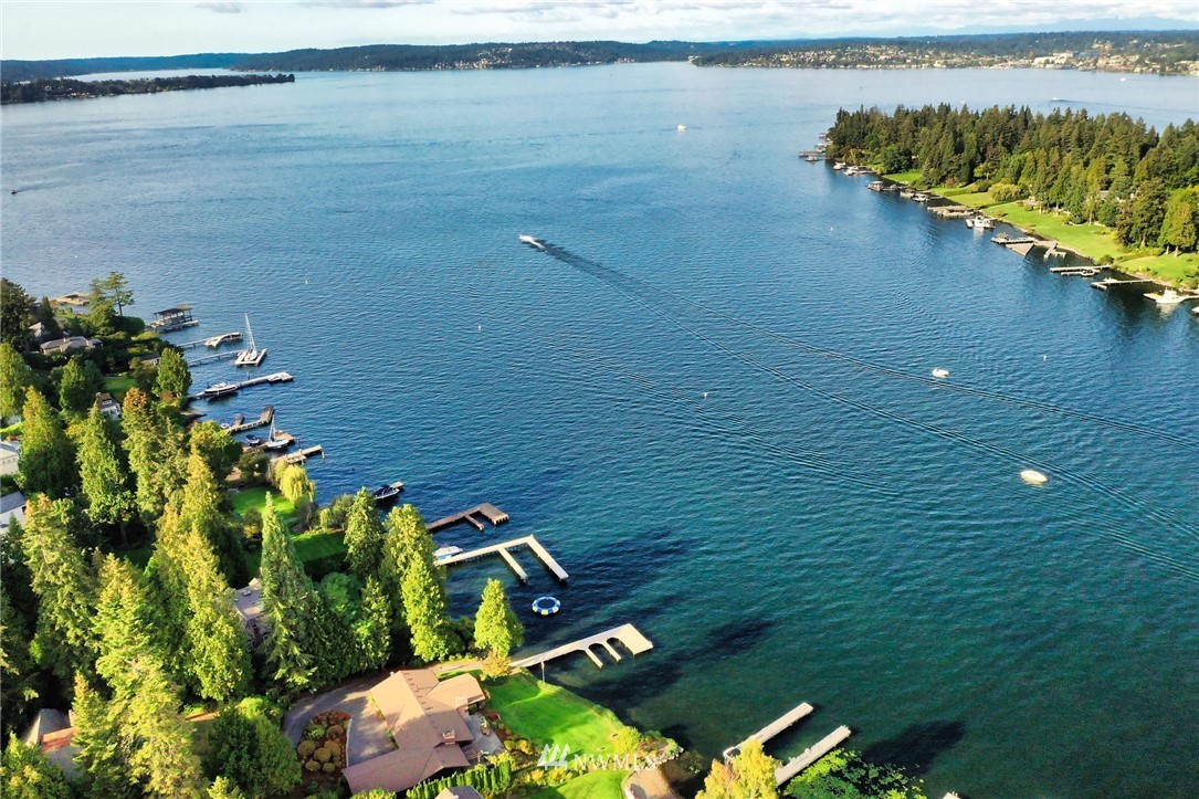 3436 Evergreen Point Road Medina, WA 98039 - Photo 13 of 16 a view of a lake with a floor to ceiling window