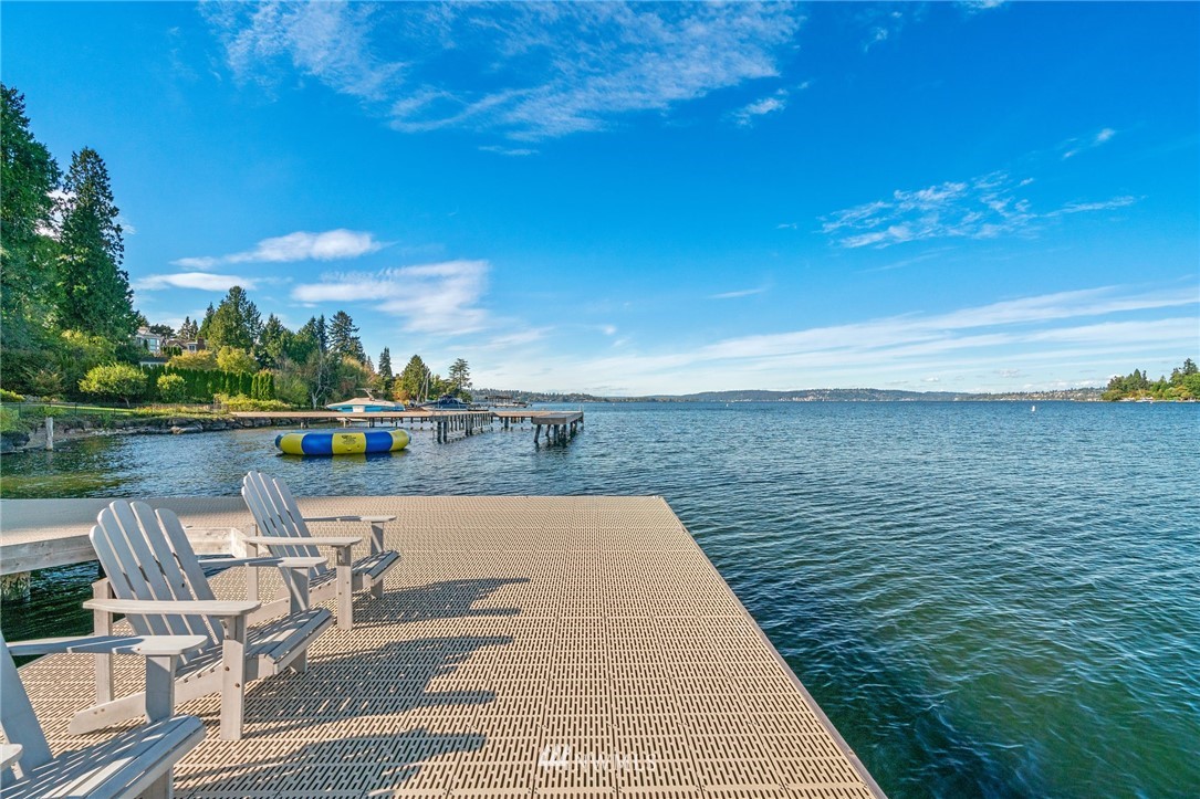 3436 Evergreen Point Road Medina, WA 98039 - Photo 14 of 16 a view of a lake with couches in the patio