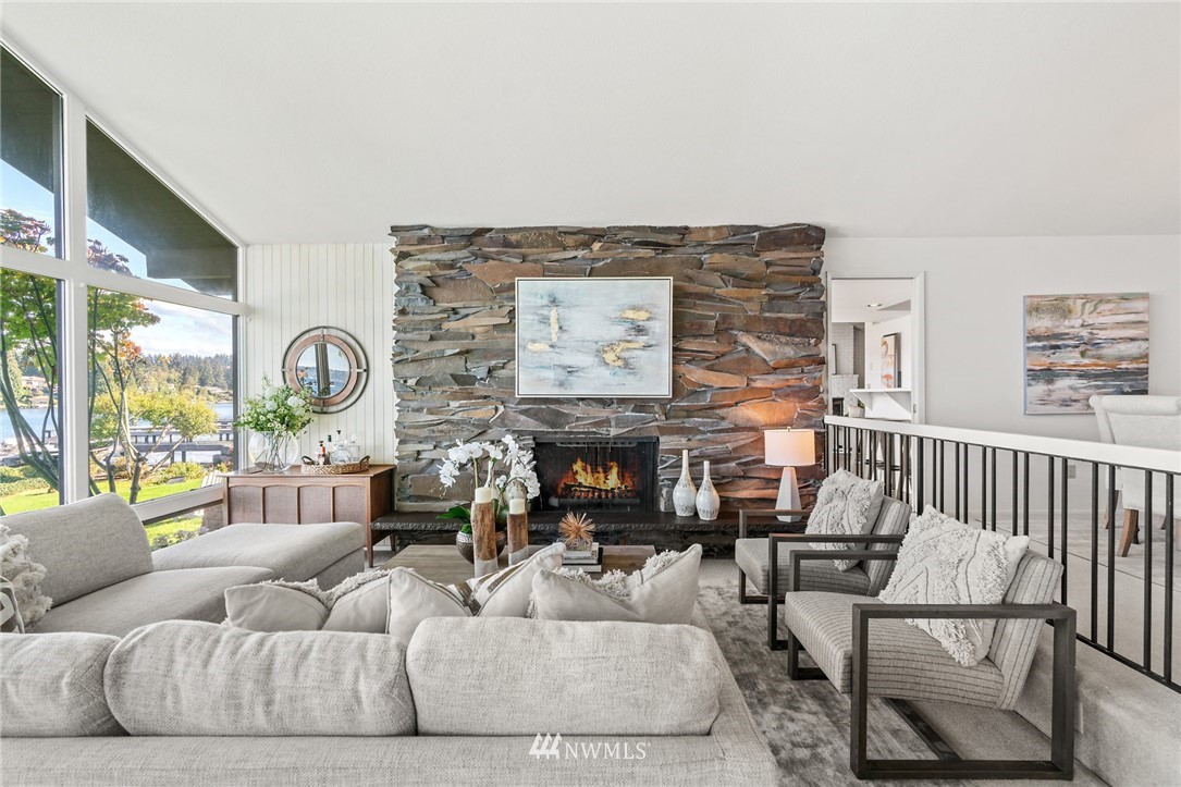 3436 Evergreen Point Road Medina, WA 98039 - Photo 5 of 16 a living room with furniture a fireplace and a large window