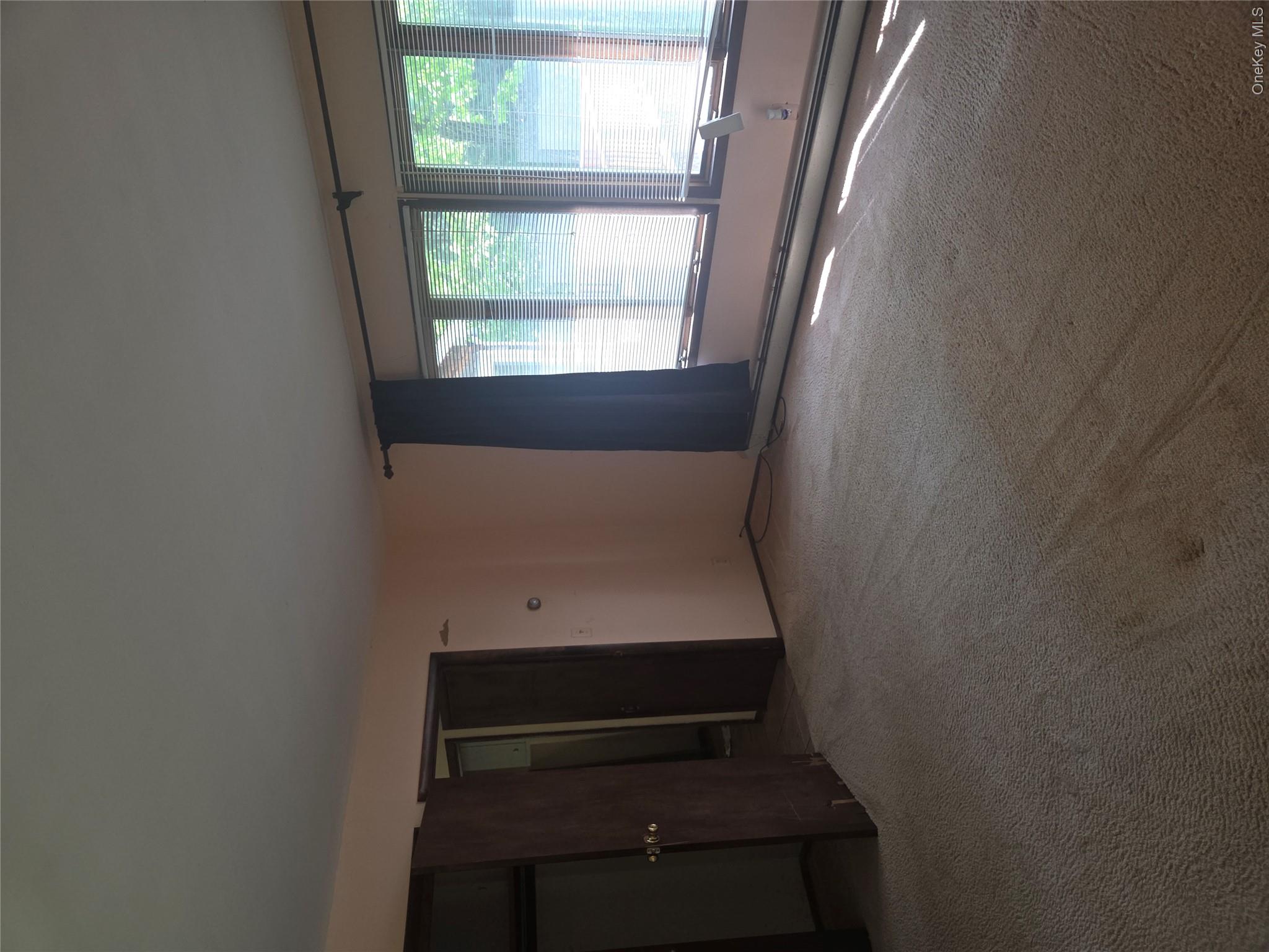 63 Otens Road Ellenville, NY 12428 - Photo 21 of 32 a view of an empty room with a window