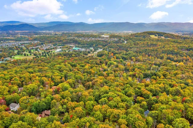 a view of a chairs and table in the balcony