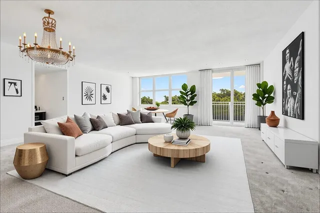 a living room with furniture and a potted plant