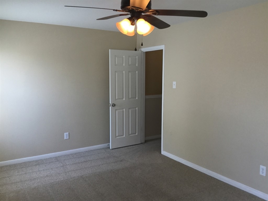 9830 Wing Street Conroe, TX 77385 - Photo 18 of 22 a view of an empty room and a fan