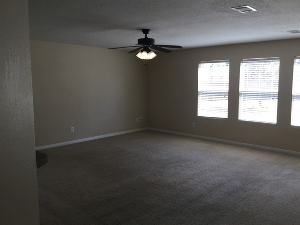 9830 Wing Street Conroe, TX 77385 - Photo 4 of 22 an empty room with a window
