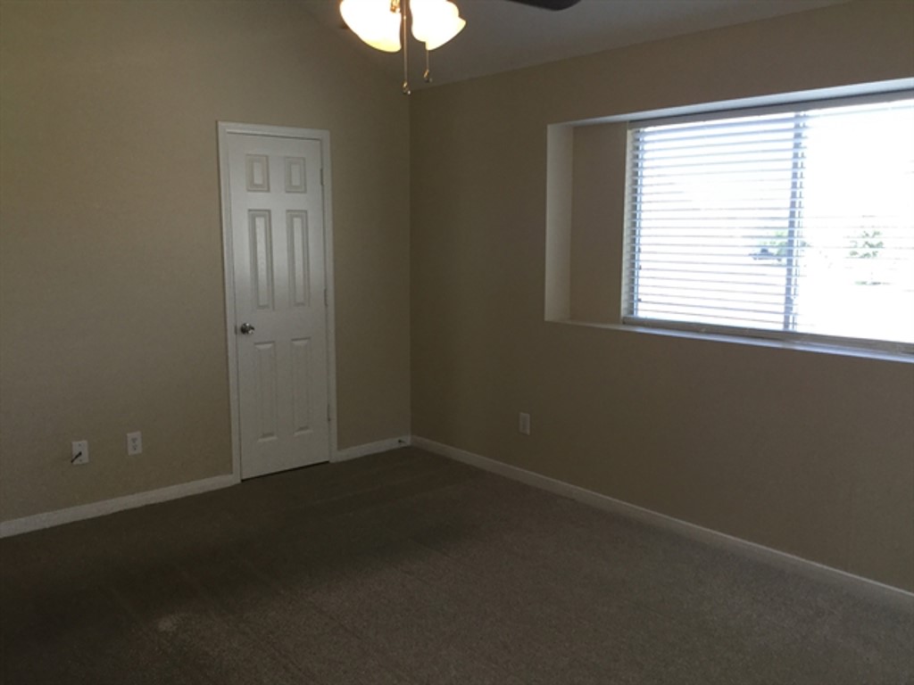 9830 Wing Street Conroe, TX 77385 - Photo 6 of 22 an empty room with a window