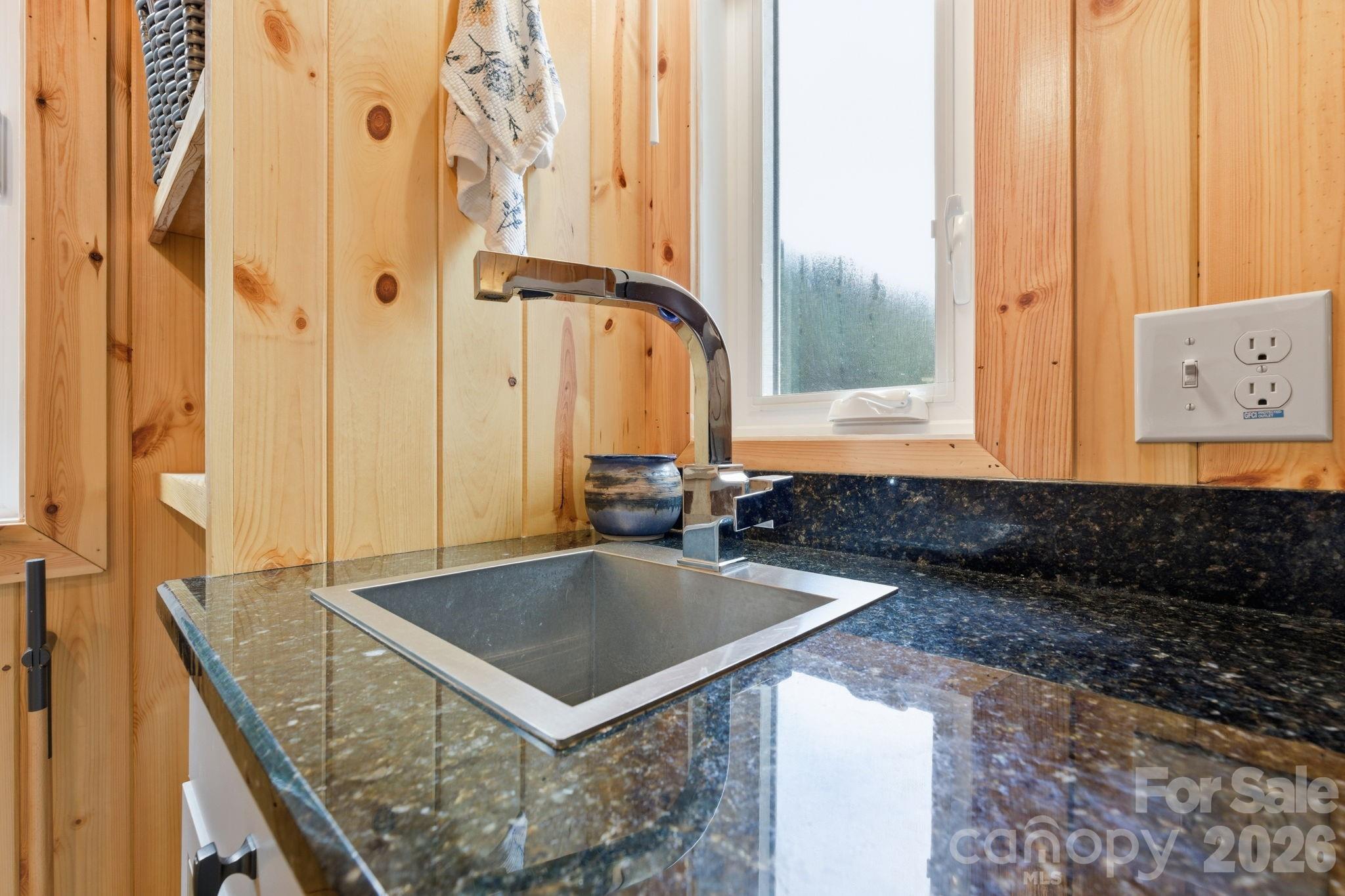 37 Coach Club Highlands, NC 28741 - Photo 14 of 37 a bathroom with a granite countertop sink and a mirror