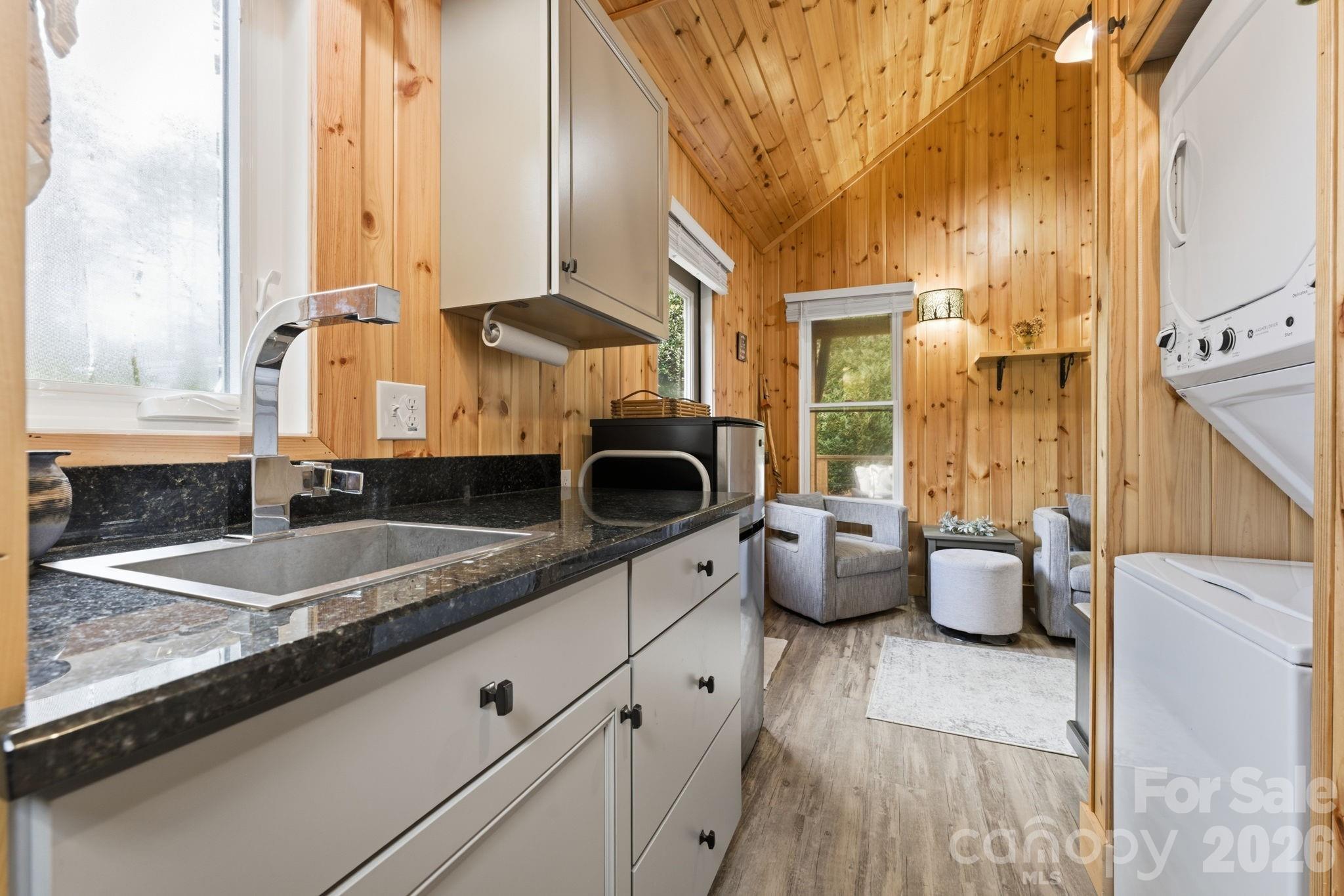 37 Coach Club Highlands, NC 28741 - Photo 15 of 37 a kitchen with stainless steel appliances granite countertop a sink and a granite counter tops