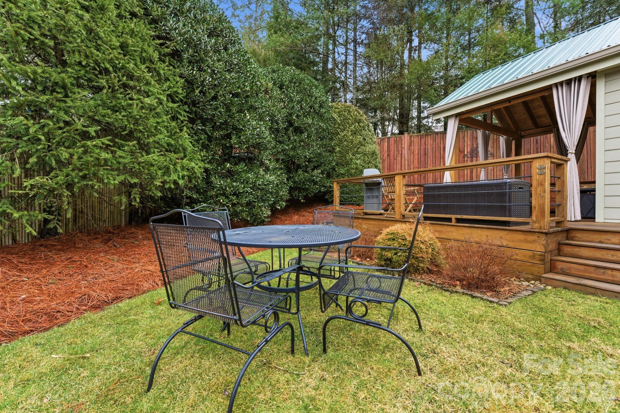 37 Coach Club Highlands, NC 28741 - Photo 30 of 37 a backyard of a house with table and chairs