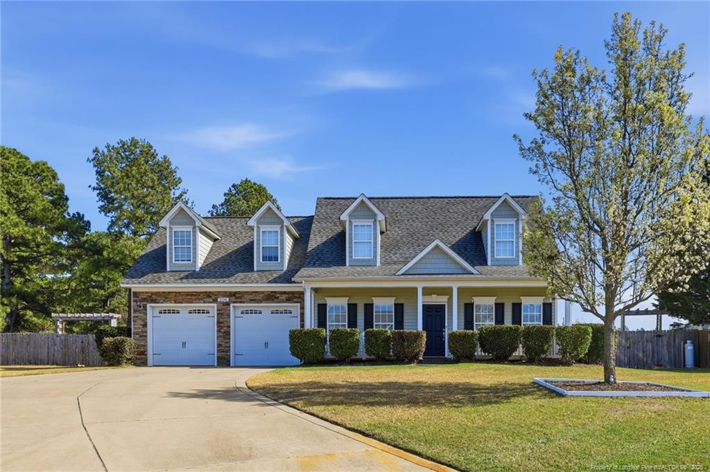 206 Blacksmith Lane Raeford, NC 28376 - Photo 1 of 48 a front view of a house with a garden
