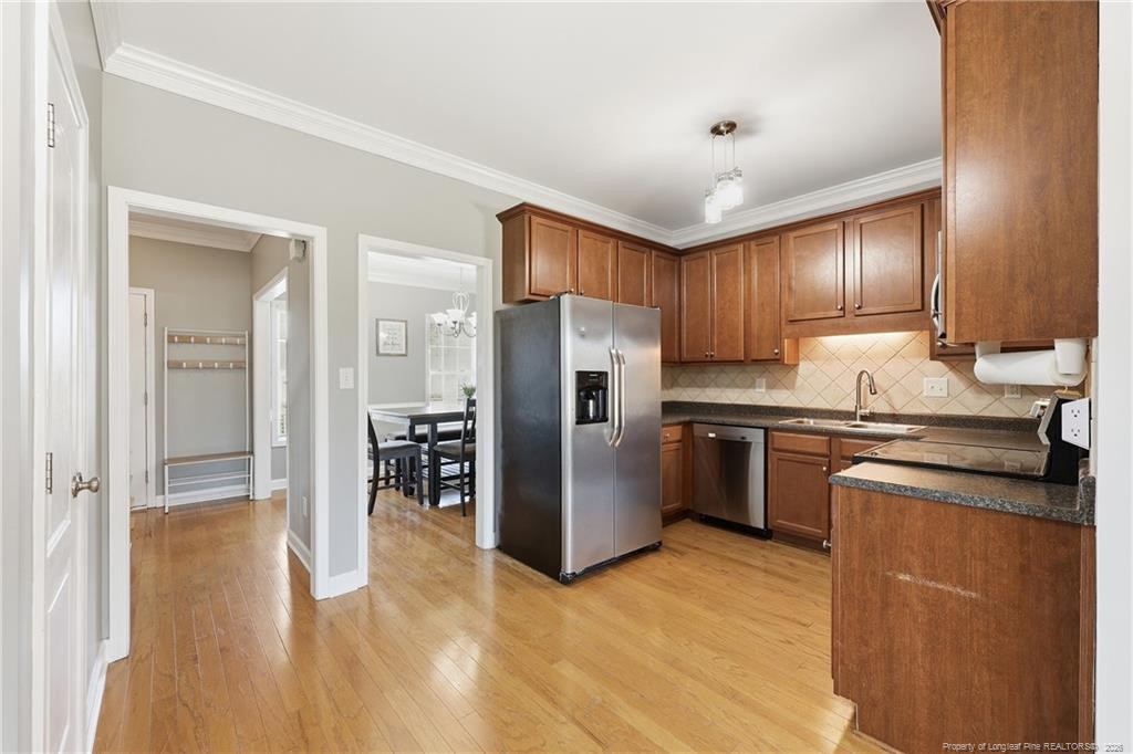 206 Blacksmith Lane Raeford, NC 28376 - Photo 12 of 48 a kitchen with granite countertop a refrigerator and a sink