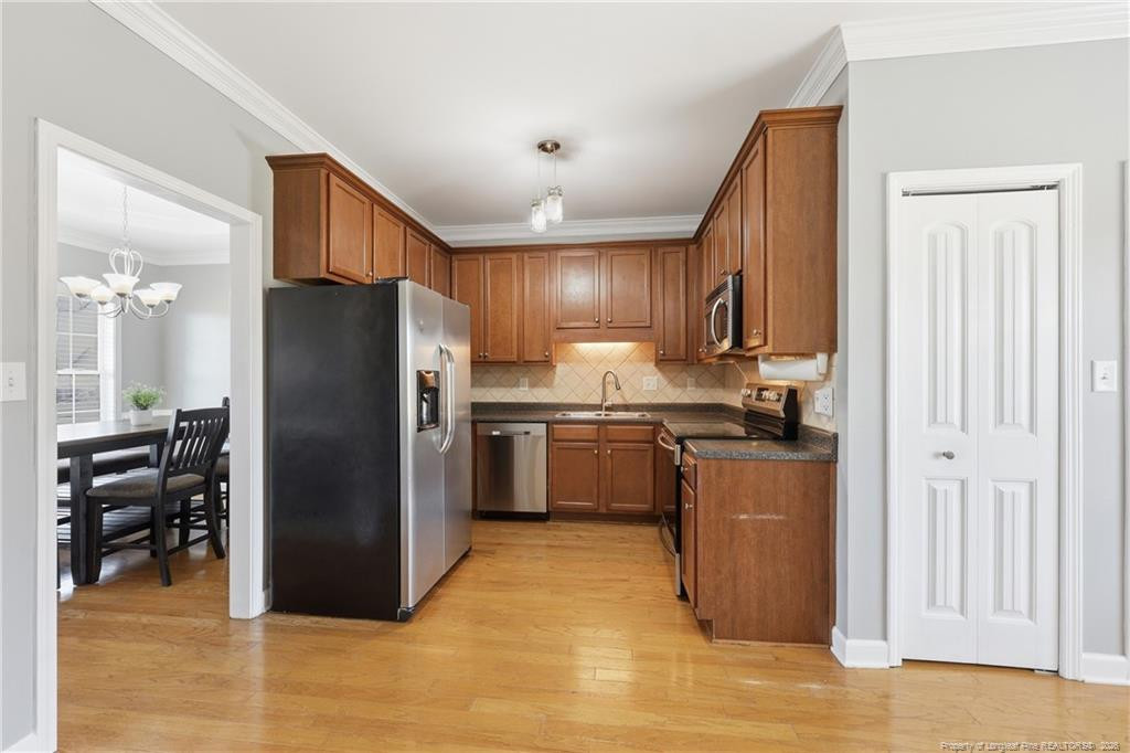 206 Blacksmith Lane Raeford, NC 28376 - Photo 13 of 48 a kitchen with stainless steel appliances granite countertop a refrigerator stove and oven