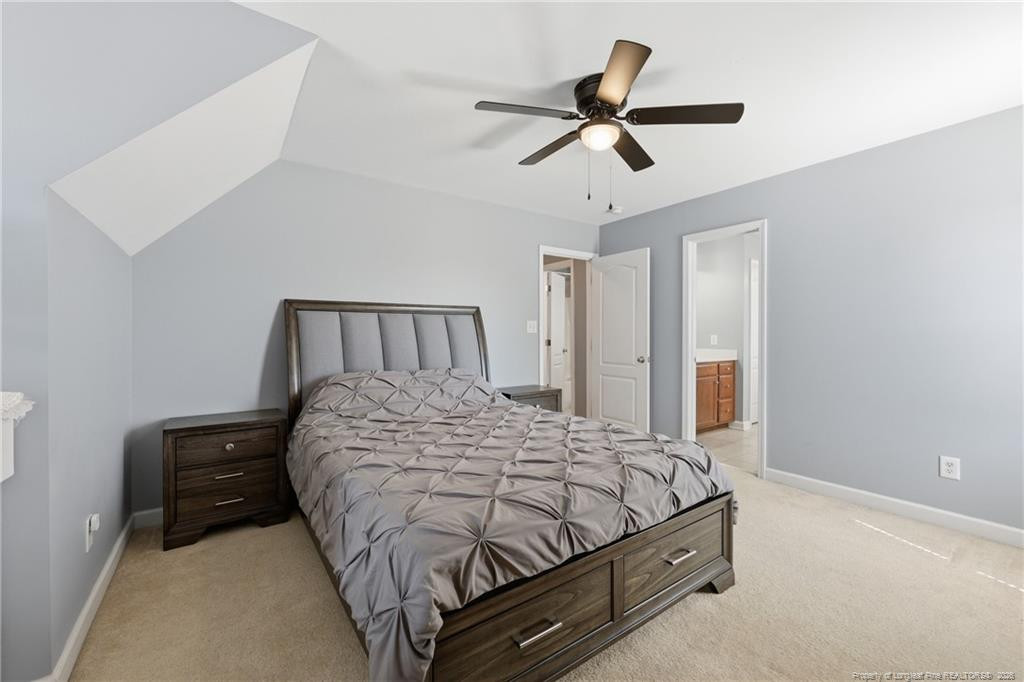 206 Blacksmith Lane Raeford, NC 28376 - Photo 24 of 48 a bedroom with a bed and window