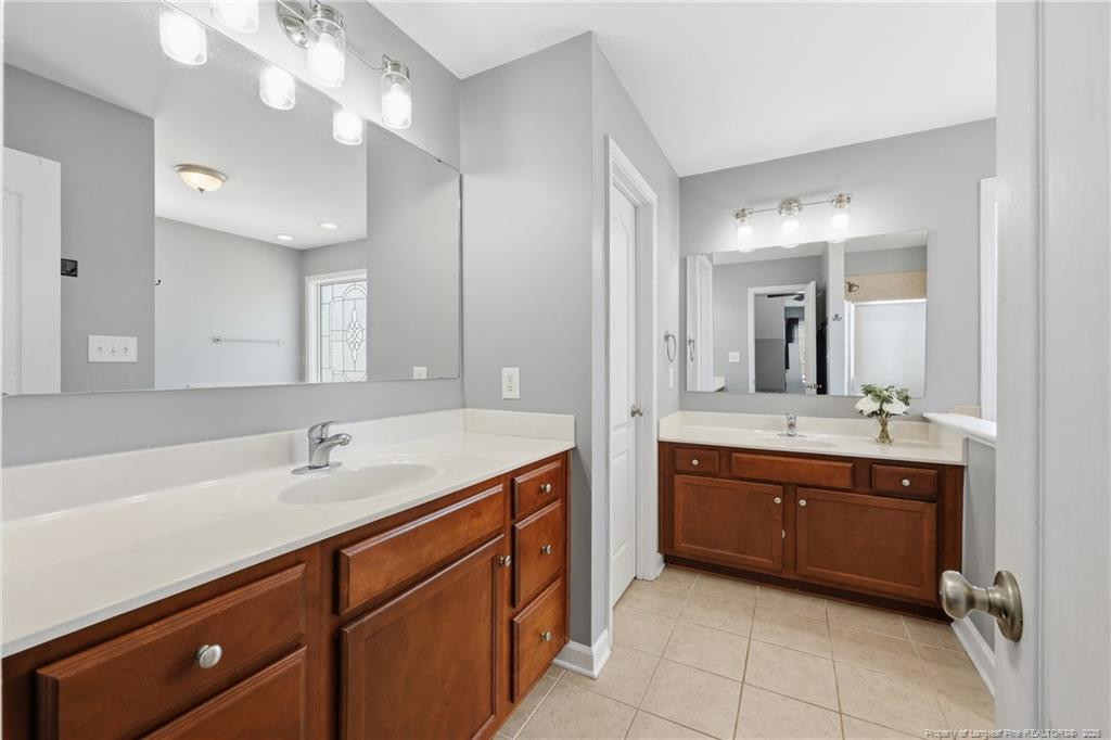 206 Blacksmith Lane Raeford, NC 28376 - Photo 25 of 48 a spacious bathroom with a tub sink and mirror