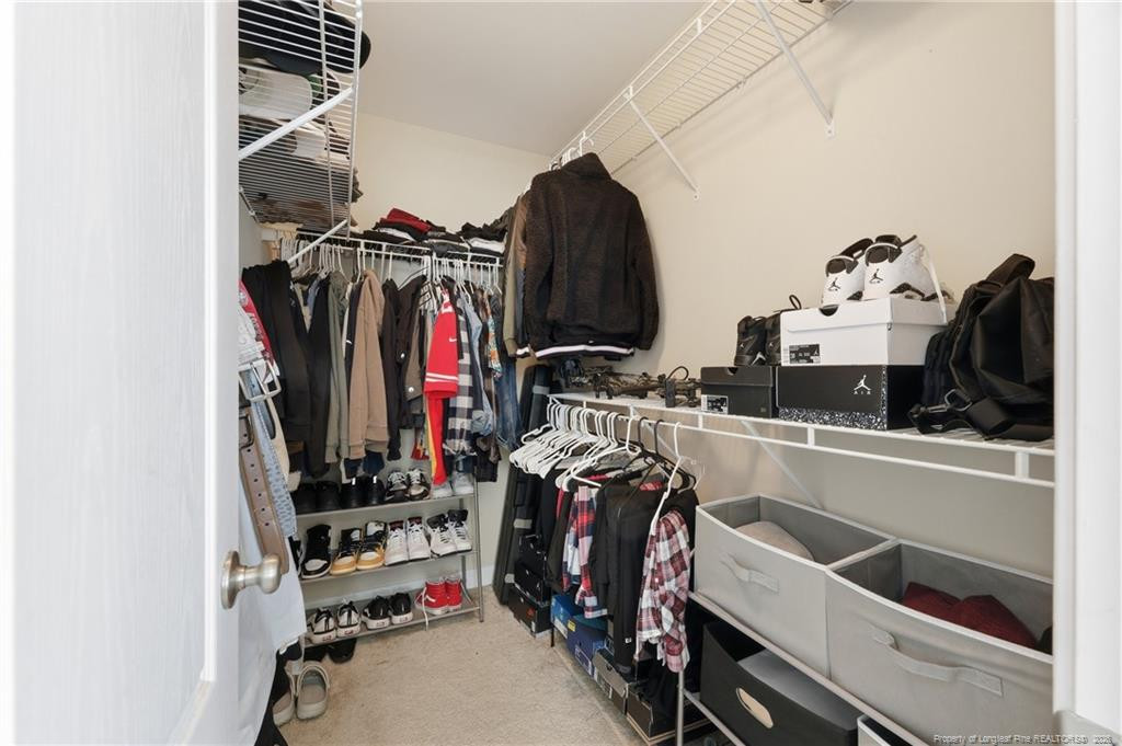 206 Blacksmith Lane Raeford, NC 28376 - Photo 28 of 48 a view of walk in closet with clothes and shoes