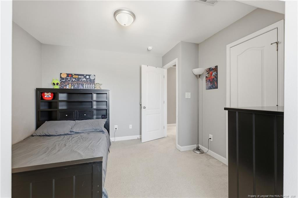 206 Blacksmith Lane Raeford, NC 28376 - Photo 31 of 48 a bed room with a bed