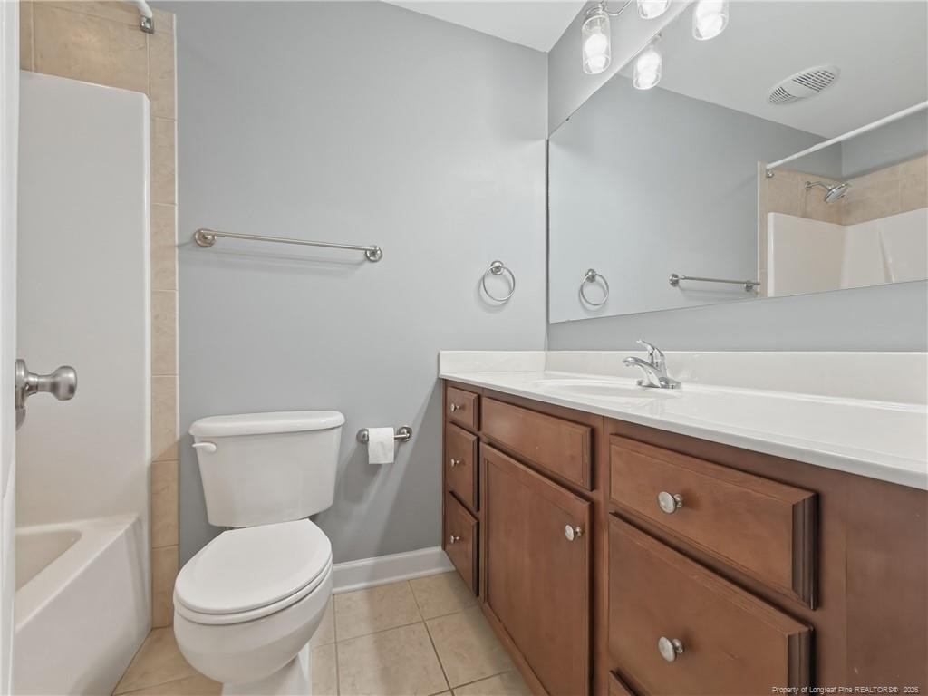 206 Blacksmith Lane Raeford, NC 28376 - Photo 32 of 48 a bathroom with a toilet sink and mirror