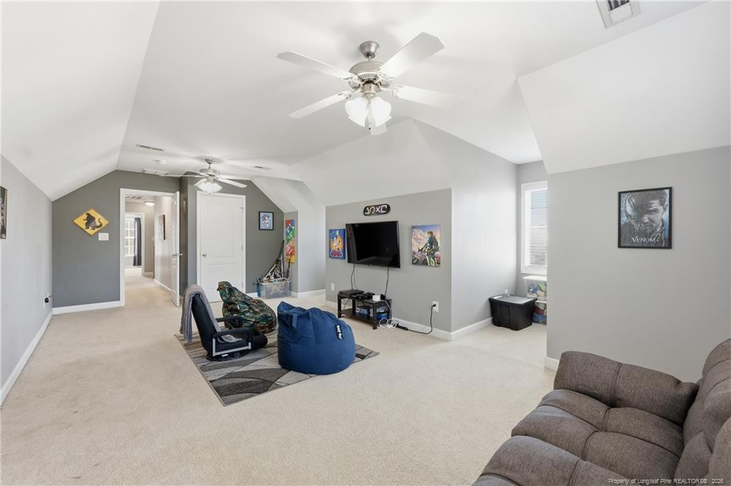 206 Blacksmith Lane Raeford, NC 28376 - Photo 36 of 48 a living room with furniture and a chandelier