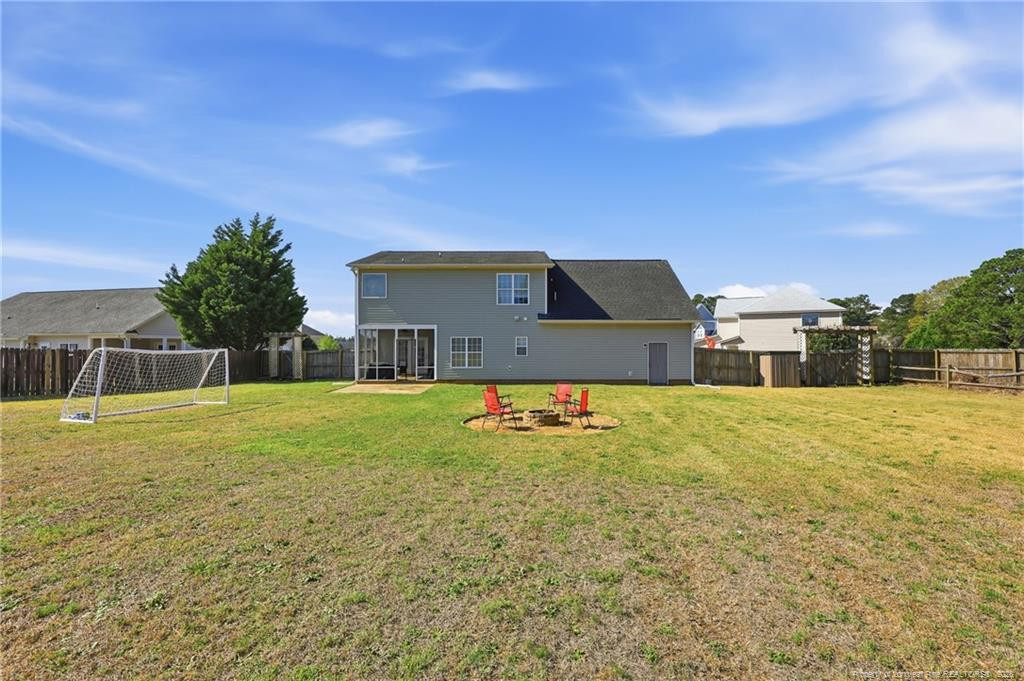 206 Blacksmith Lane Raeford, NC 28376 - Photo 42 of 48 a view of a house with pool and a yard
