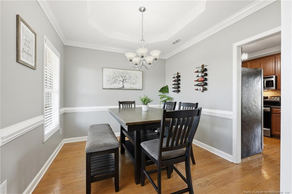 206 Blacksmith Lane Raeford, NC 28376 - Photo 9 of 48 a view of a dining room with furniture window and wooden floor