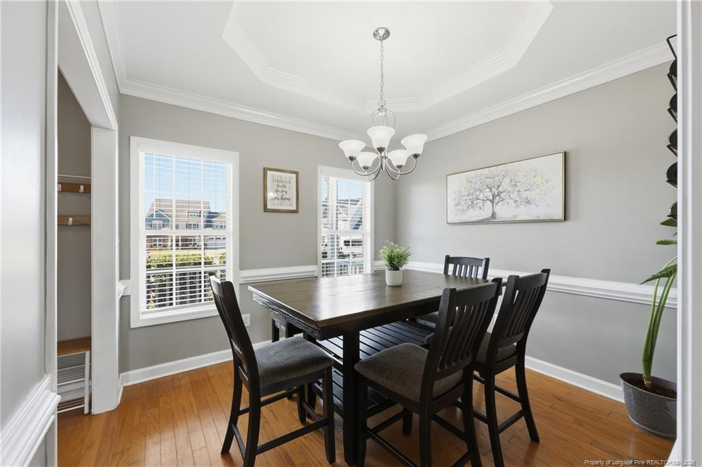 206 Blacksmith Lane Raeford, NC 28376 - Photo 10 of 48 a view of a dining room with furniture window and wooden floor