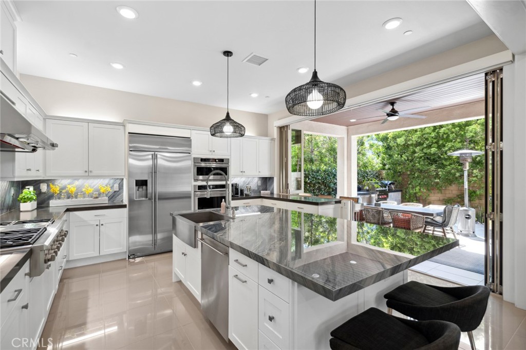 131 Spiral Irvine, CA 92618 - Photo 1 of 39 a kitchen with stainless steel appliances granite countertop a stove and refrigerator